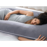 Full body pillow designed for maternity comfort and restful sleep