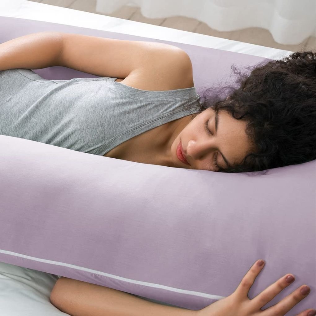 Purple pregnancy pillow providing head-to-toe support for moms-to-be