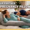 Couple sleeping comfortably with a pregnancy pillow showing that partners can also use pregnancy pillows for better sleep support